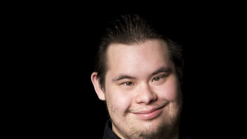 A young man with down syndrome.