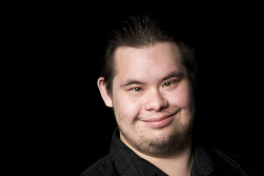 A young man with down syndrome.
