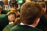 Primary school children work in a classroom