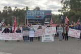 Striking workers and their supporters holding flags and placards outside the Griffin Coal mine.