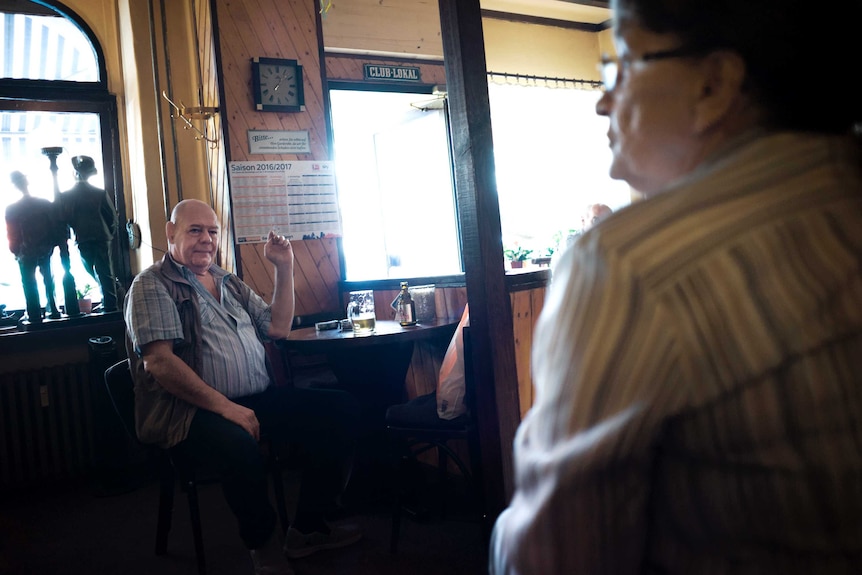 A man sitting in a bar.