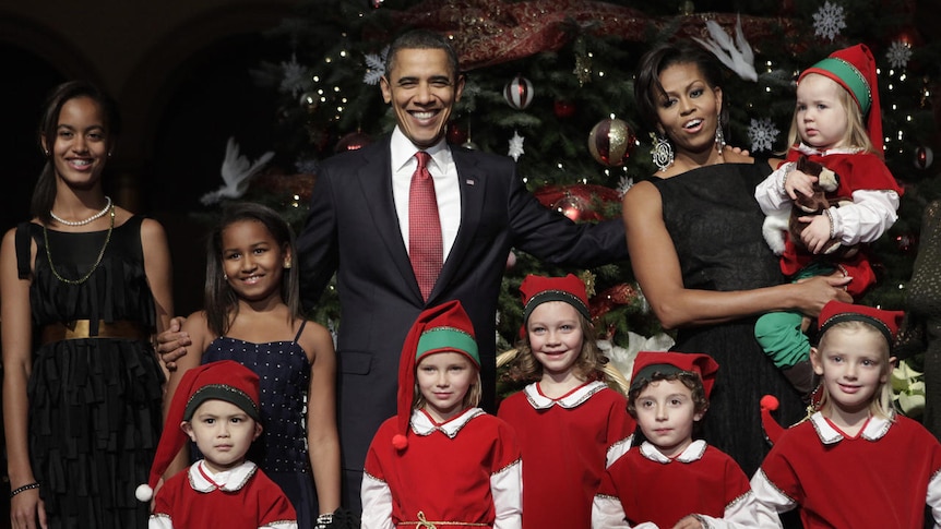 Barack and Michelle Obama celebrate Christmas with their daughters Malia (L) and Sasha (2nd L)