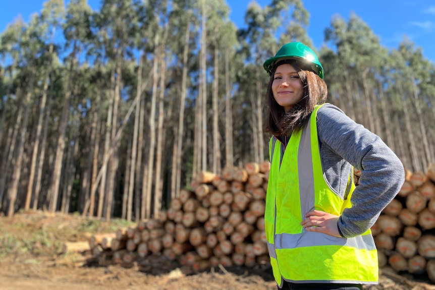 PhD researcher and Forico project officer Michelle Balasso stand triumphant in from of a pile of niten logs.