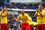 Adlene Guedioura (C) and Watford team-mates celebrate their win over Brighton and Hove Albion.