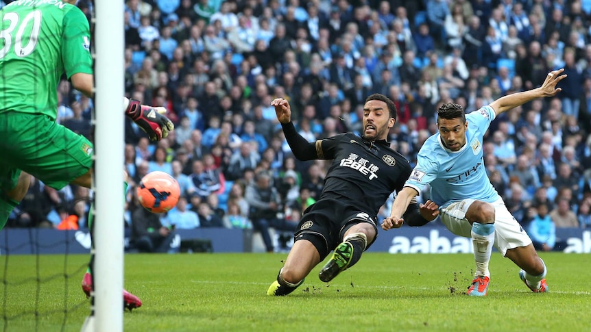 Wigan's James Perch gets past Gael Clichy to score against Manchester City in the FA Cup.