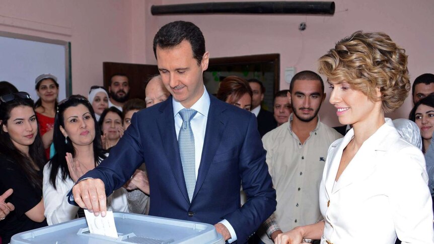 President Bashar al-Assad and his wife Asma cast their votes