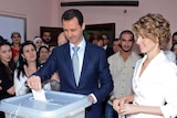 President Bashar al-Assad and his wife Asma cast their votes