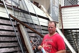 Top storey of house demolished during Townsville storm.