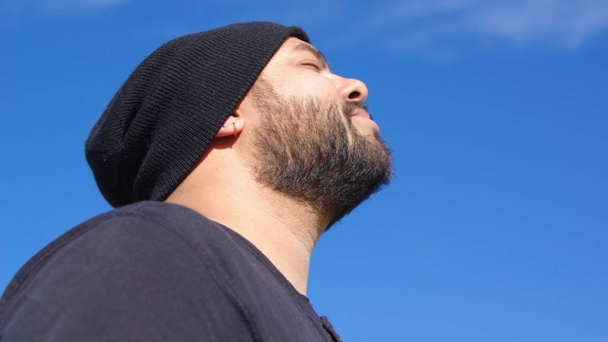Perth musician Troy Roberts looks up at the sky.