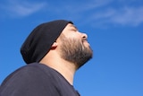 Perth musician Troy Roberts looks up at the sky.