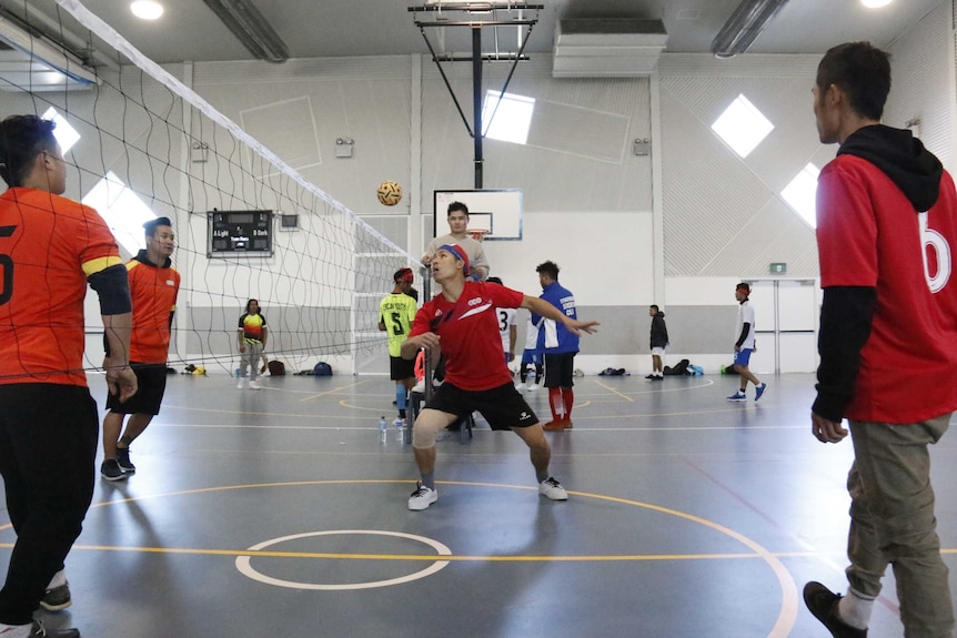 A player eyes a ball over his head.