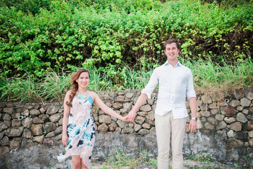 Michael and Pauline Dignam holding hands.