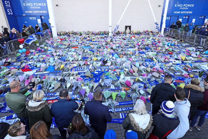 Supporters pay tribute outside Leicester City Football Club after the helicopter crash.