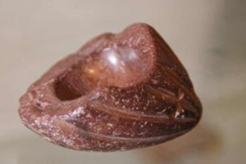 Close up of a mortar shaped like a cacao pod from the Santa Ana-La Florida site