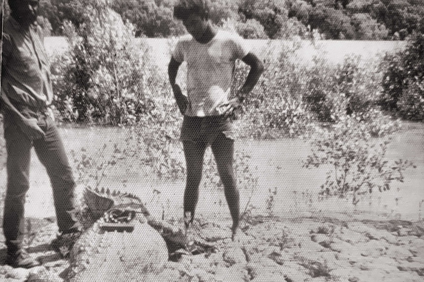 Peter Pangquee pictured centre frame with a captured crocodile.