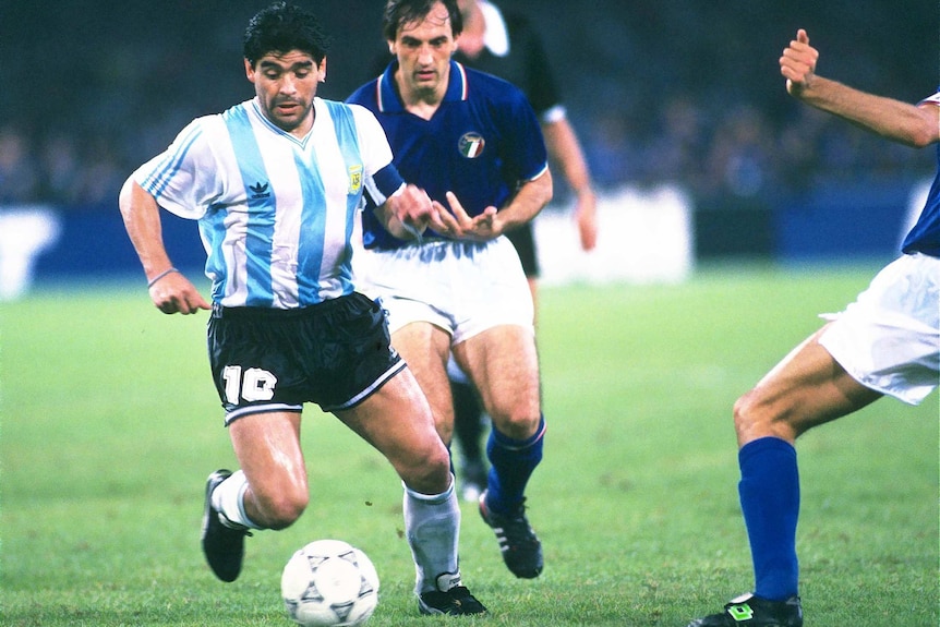 Argentina's Diego Maradona dribbles the ball against Italy at the 1990 FIFA World Cup.