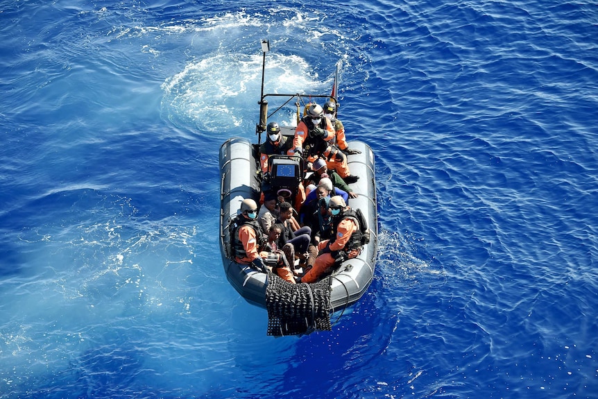 Migrants and refugees are transported to the German navy frigate ship Werra