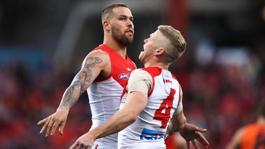 Lance Franklin and Dan Hannebery bump their chests against each other.