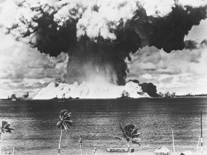 A mushroom cloud rises from the waters of Bikini Lagoon as the US conducts an underwater atomic test.
