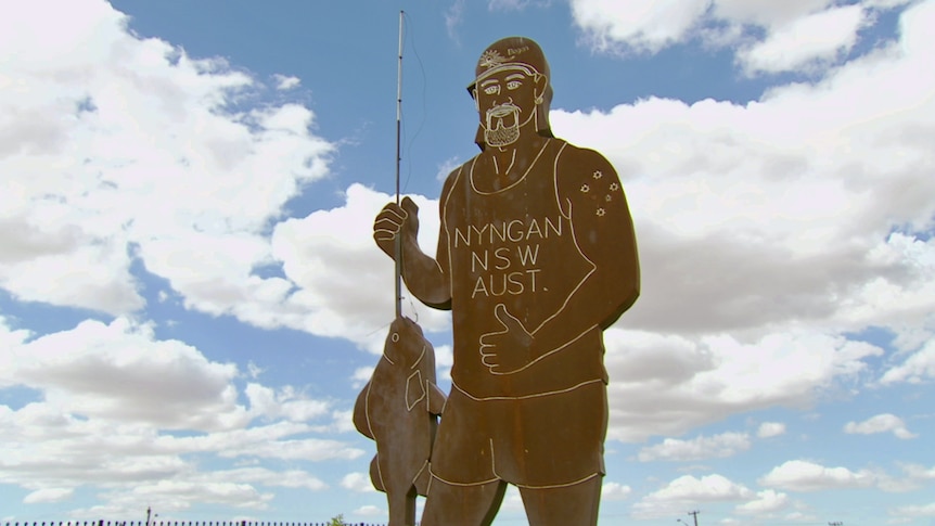 The Big Bogan is a five-metre-tall steel carving with a thumbs up, cap, mullet, and fishing rod.