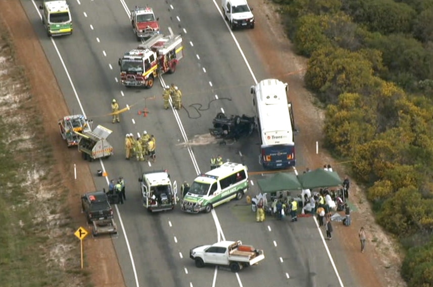 An aerial image of a car lying on its roof next to a bus after a crash on Indian Ocean Drive.