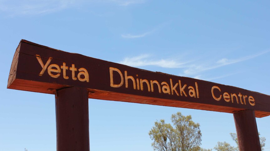 A wooden sign with Yetta Dhinnakkal Centre written on it