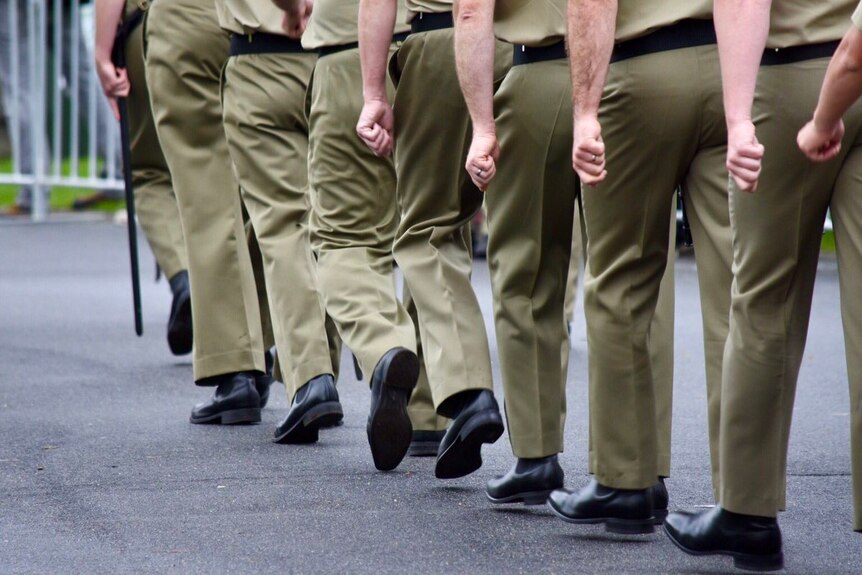 Legs of soldiers marching to the Shrine of Remembrance in Melbourne on Anzac Day, 2017.