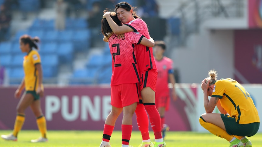  South Korea celebrate their 1-0 victory while Matildas' Alanna Kennedy shows dejection