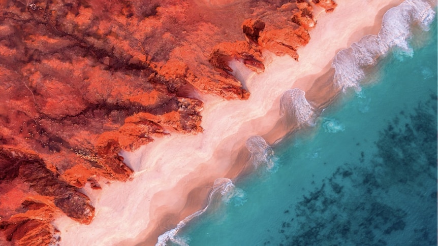 Vibrant red, tourquise, and sand colours of the Kimberley coastline in the North West of Western Australia