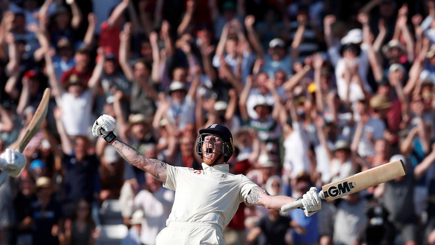 England batsman Ben Stokes spreads his arms, with bat in hand, as he screams. The English crowd screams behind him.