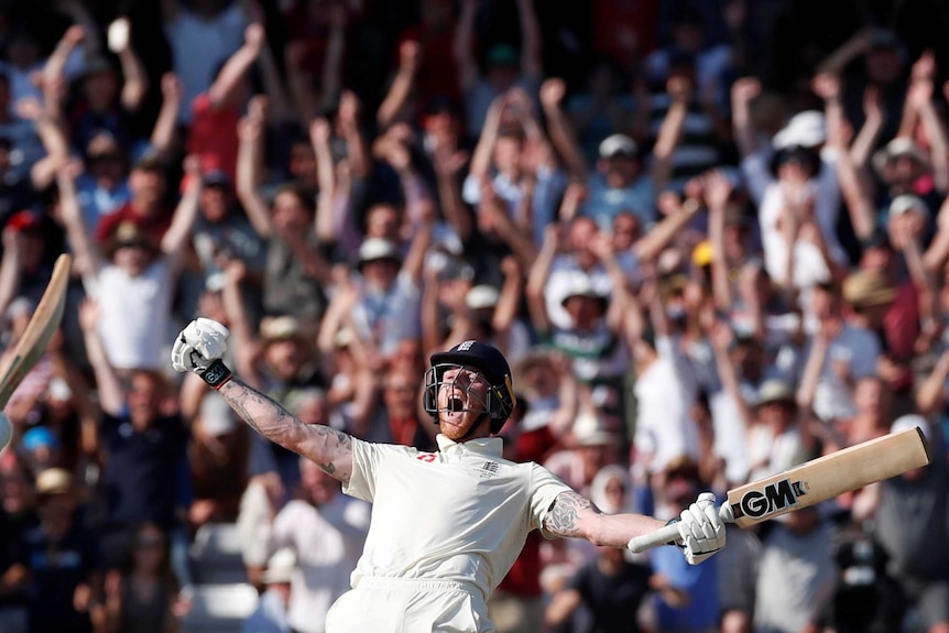 England batsman Ben Stokes spreads his arms, with bat in hand, as he screams. The English crowd screams behind him.