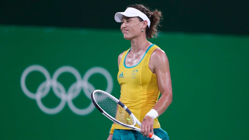 Stosur grimaces against Kerber