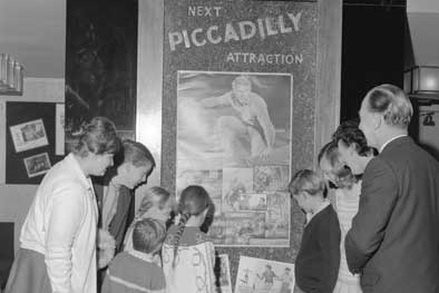 Piccadilly Theatre film billboard and audience c1967