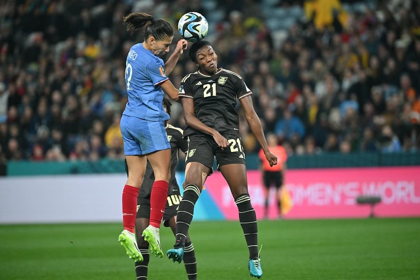 Players fight for a header.