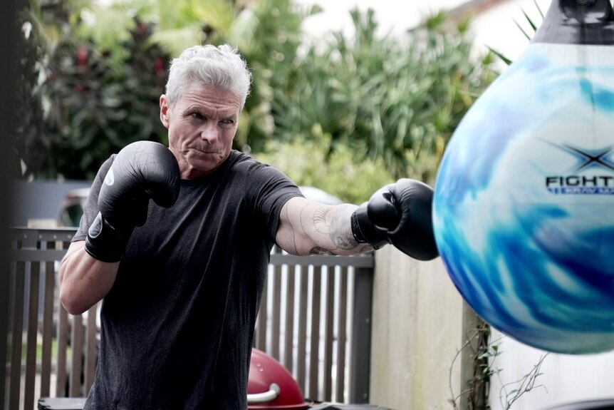 David McBride punches a boxing ball.