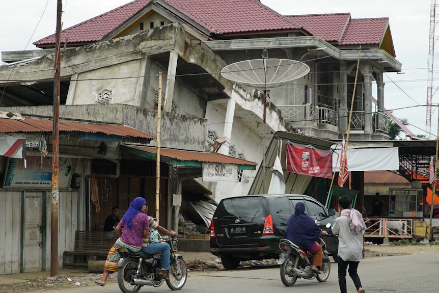 A collapsed building in a town hit by a magnitude 6.4 earthquake.