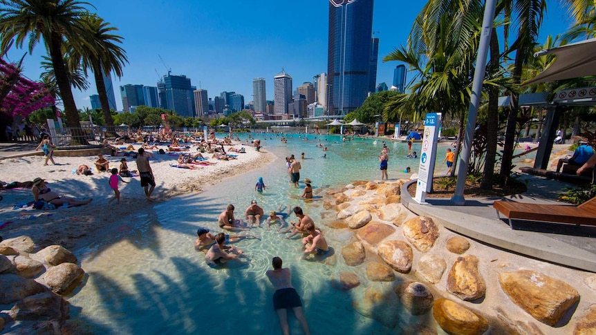Crowds gather to escape the heat to swim in the pool at Streets Beach at South Bank Parklands in Brisbane.