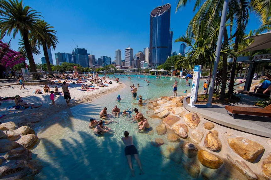 Crowds gather to escape the heat to swim in the pool at Streets Beach at South Bank Parklands in Brisbane.