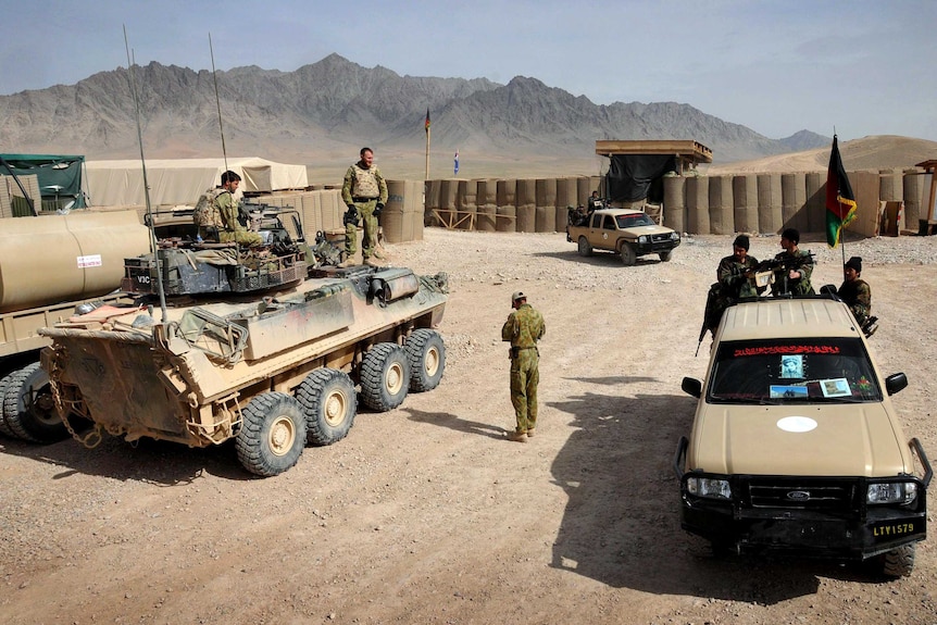ANA soldiers next to Australian LAV at Forward Operating Base Buman in Uruzgan, Afghanistan.