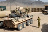 ANA soldiers next to Australian LAV at Forward Operating Base Buman in Uruzgan, Afghanistan.