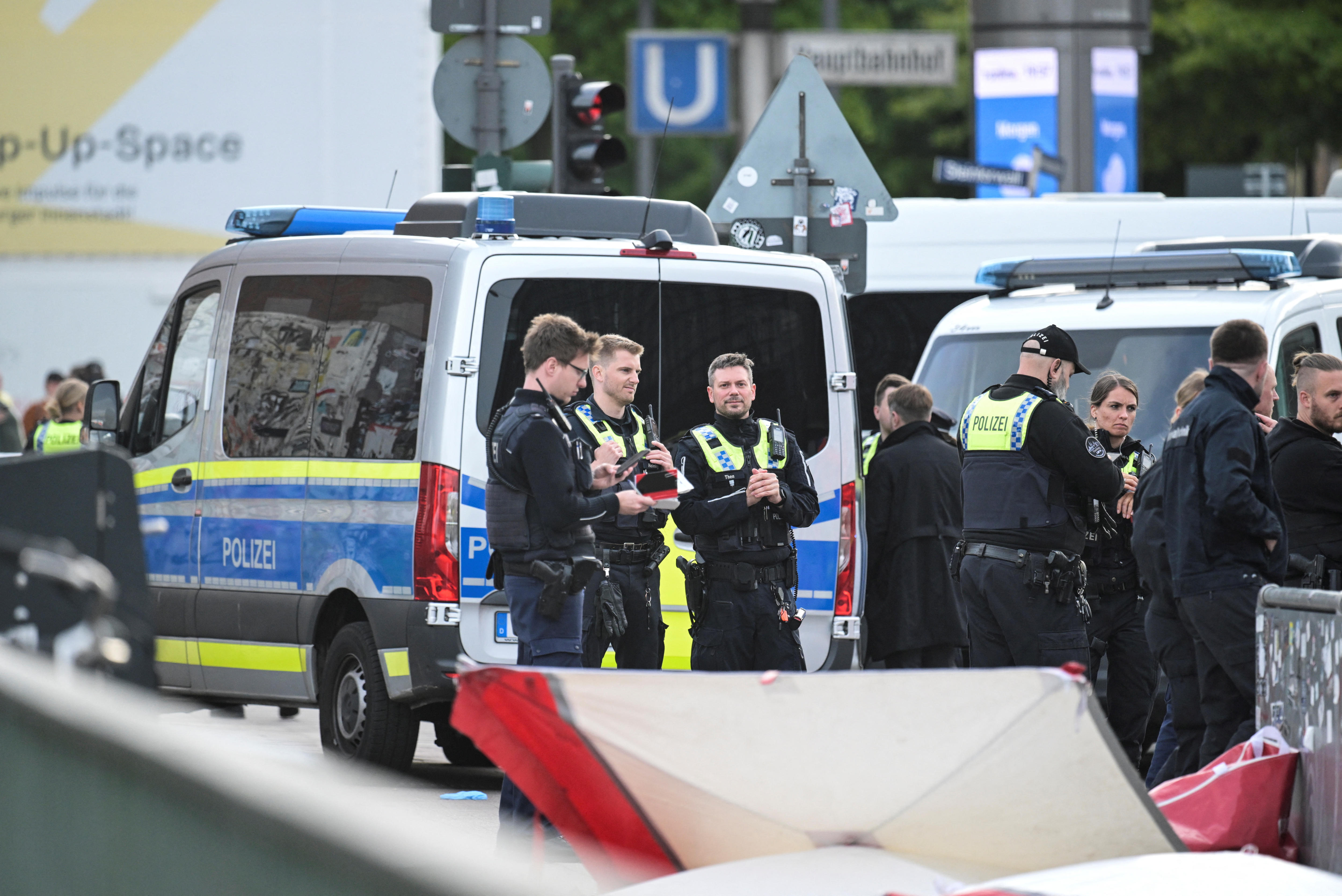 Police officers protect the area at Hamburg main station.