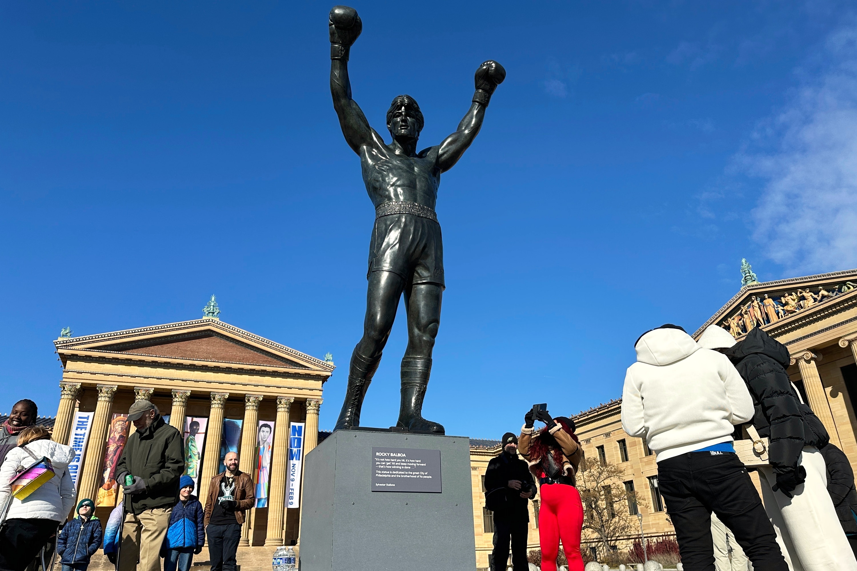 Tourists gather around the Rocky statue in Philadelphia