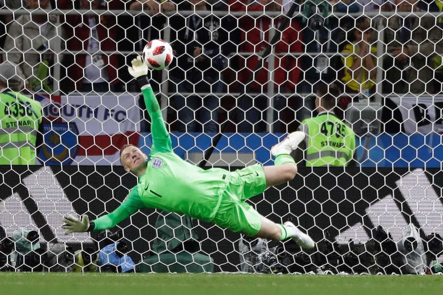 England goalkeeper Jordan Pickford saves a penalty during the round of 16 match against Colombia.