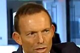 Opposition leader Tony Abbott speaks during an interview