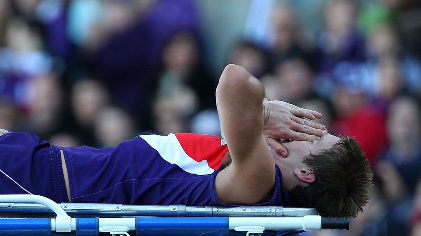 Season over ... Michael Barlow leaves the ground on a stretcher