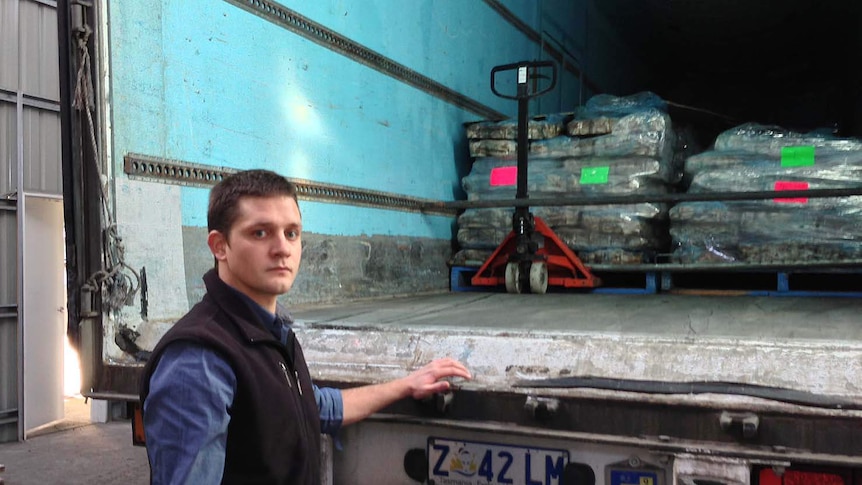 Matt Berry from seafood freighter TasTrans with a shipment of frozen squid.