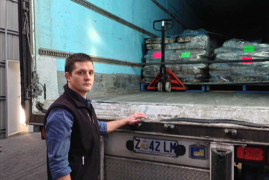 Matt Berry from seafood freighter TasTrans with a shipment of frozen squid.