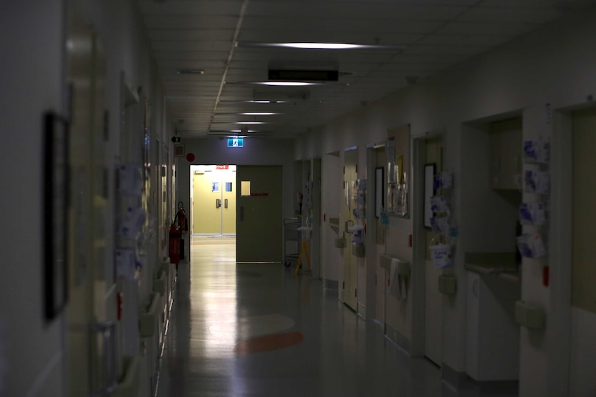 An empty corridor in Royal Perth Hospital with very dimmed lights