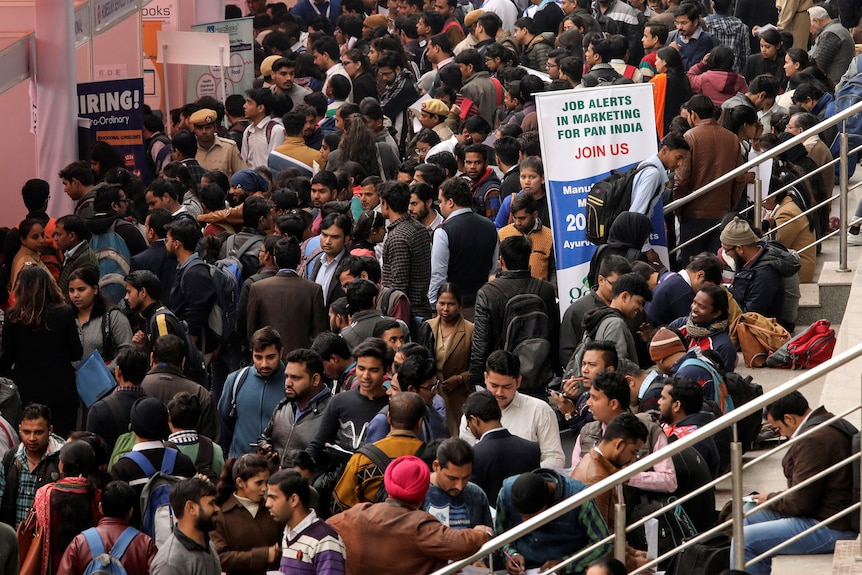 Thousands of job seekers attend a job fair in India.