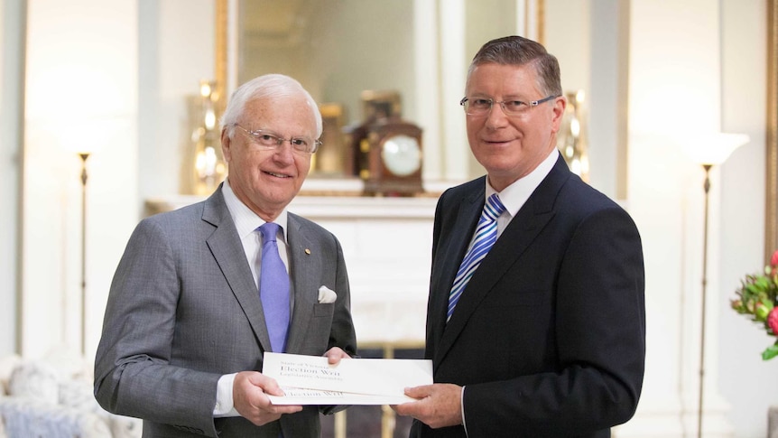 Premier Denis Napthine with Governor Alex Chernov and the 2014 Victorian election writs.
